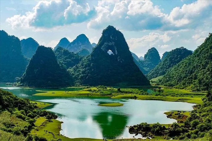 Scenic view of a lake reflecting the unique Angel Eye Mountain karst.